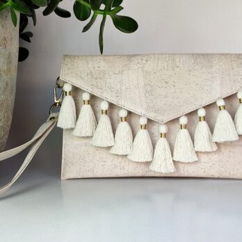 Off white cork envelope bag with tassels